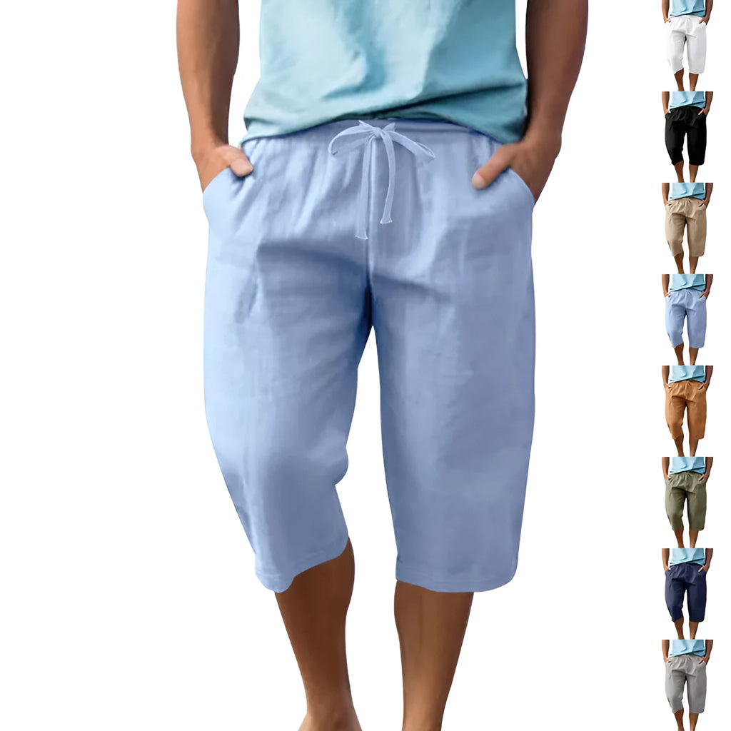 Men's loose linen shorts in light blue with drawstring waist and cropped length on white background