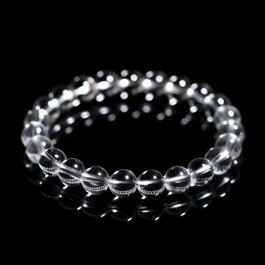 Natural old mine white crystal bead bracelet with geometric design on a wrist.