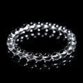 Natural old mine white crystal bead bracelet with geometric design on a wrist.