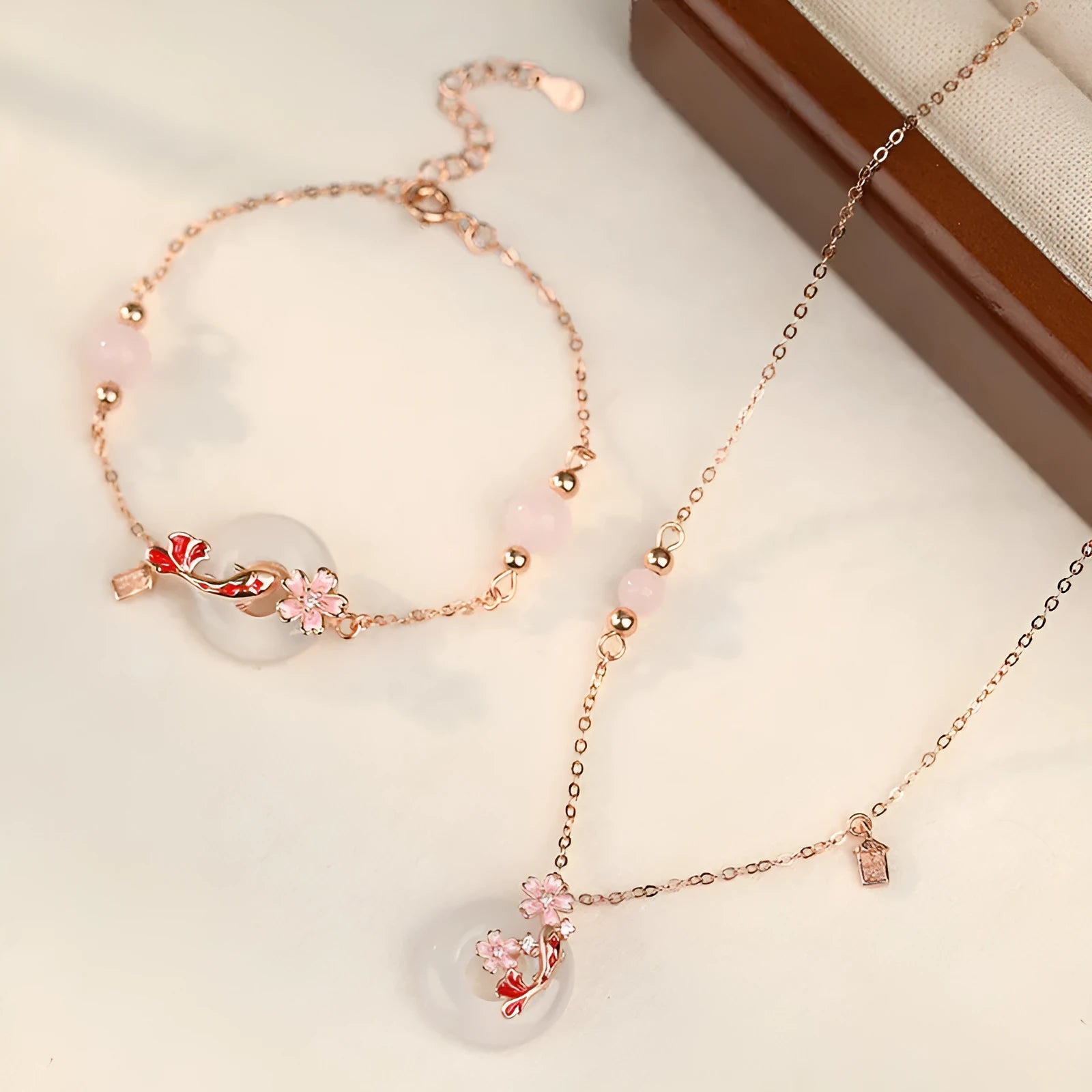 S925 sterling silver bracelet with white chalcedony crystals and koi design on female wrist