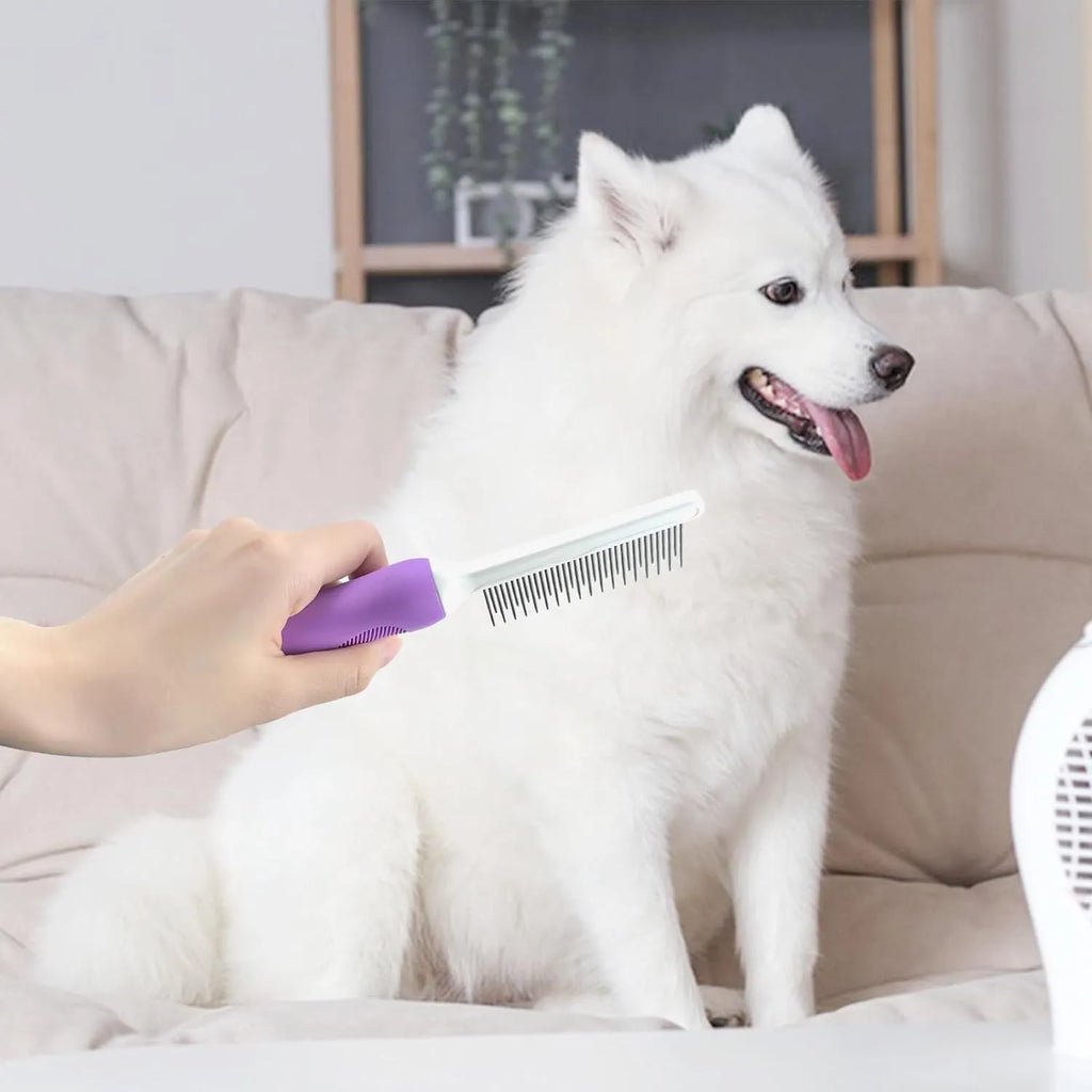 Purple pet grooming comb with stainless steel long and short teeth on a wooden surface.