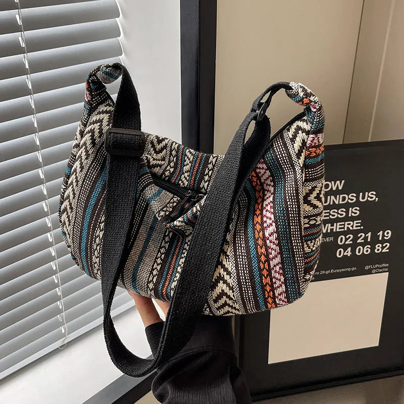 Women's ethnic style canvas dumpling crossbody bag in five colours.