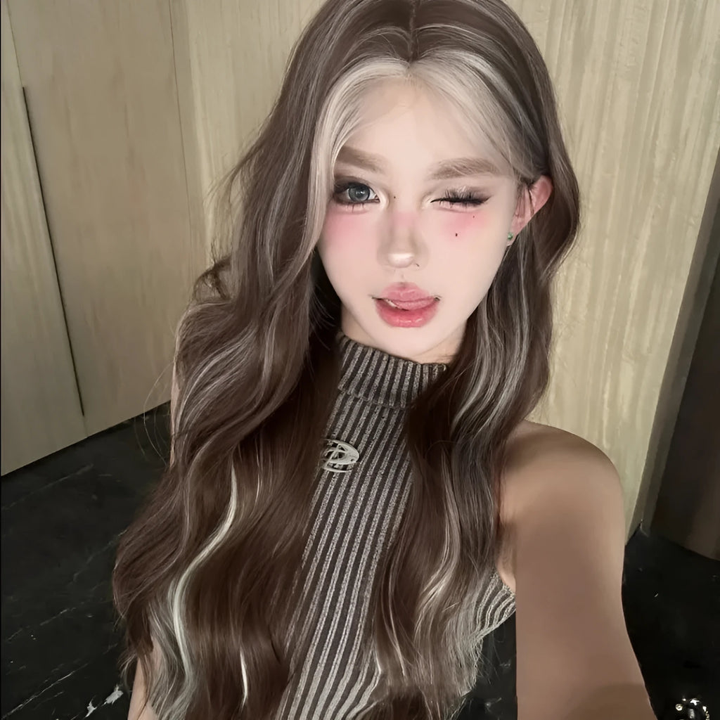 A long curly synthetic wig in a lace grey gold colour on a mannequin head.