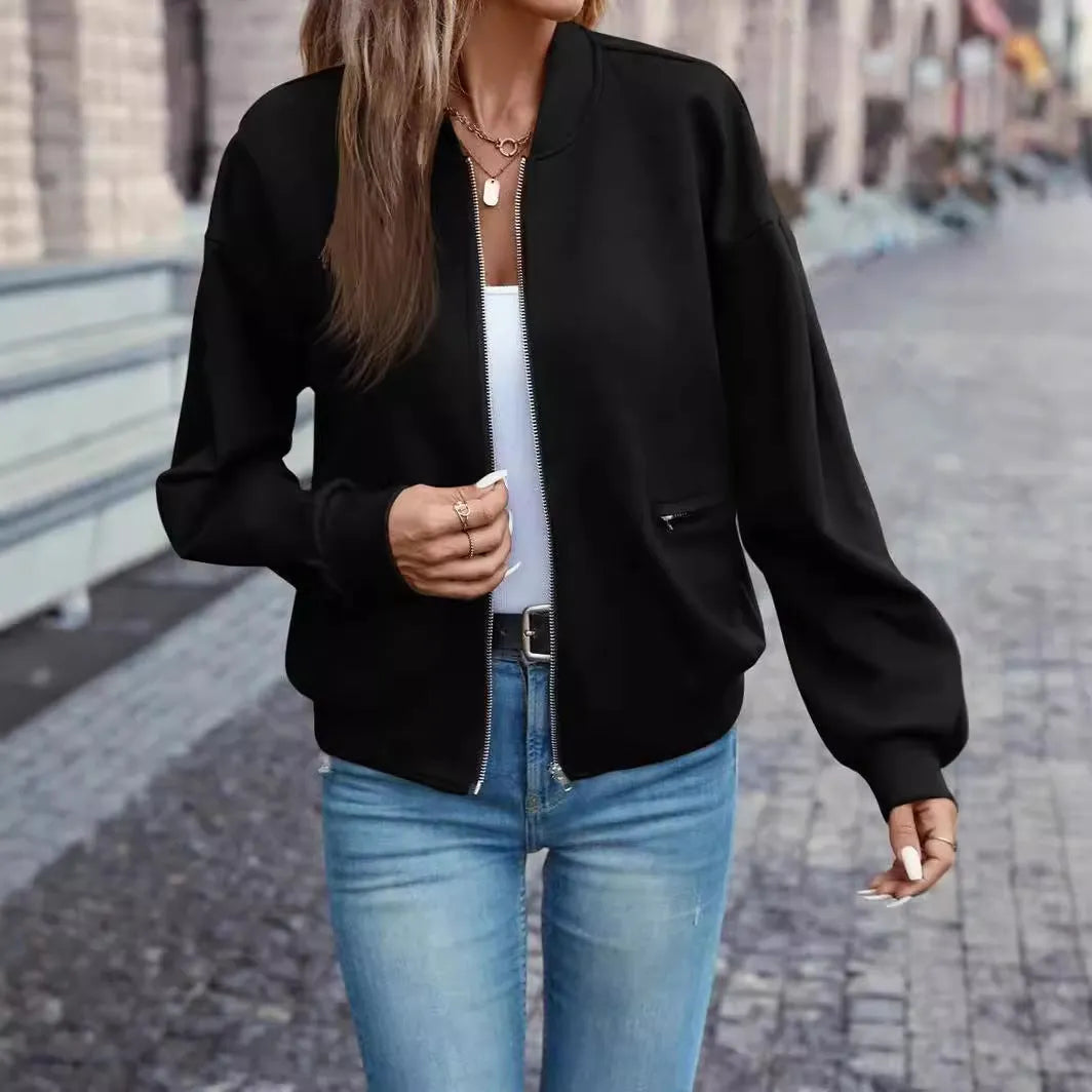 A black women's long sleeve zip-up casual jacket with faux pockets.