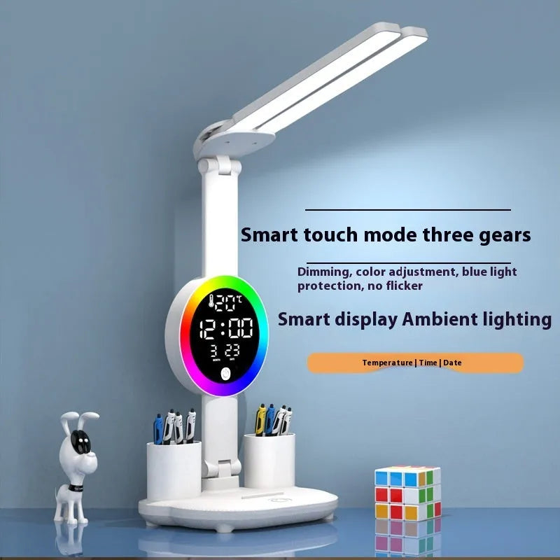 LED student rechargeable desk lamp with clock display, USB cable, and modern white finish on a desk.