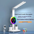 LED student rechargeable desk lamp with clock display, USB cable, and modern white finish on a desk.