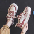 Women's pink spring sneakers with low top design and rubber sole