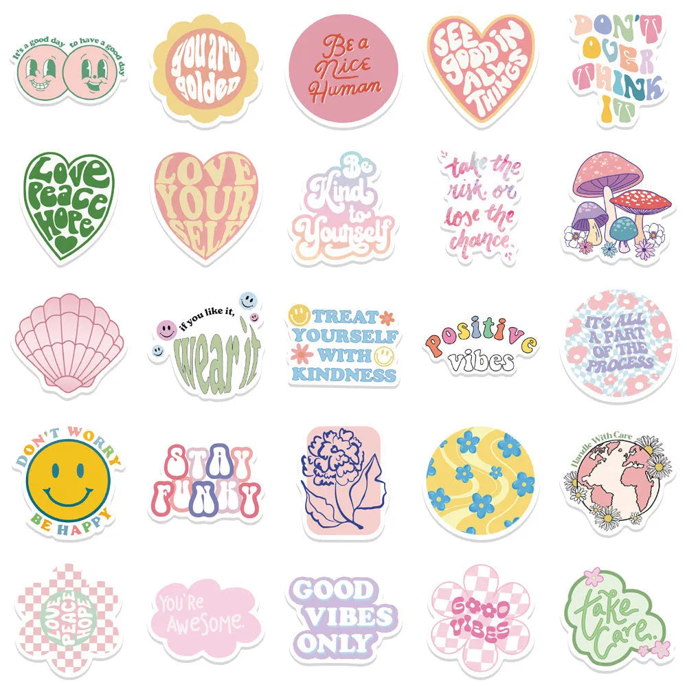 Danish pink motivational statement stickers with graffiti and cartoon designs on a laptop.