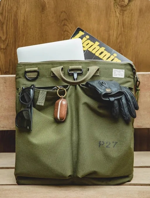 Canvas crossbody messenger bag in retro style showing military green colour with shoulder strap