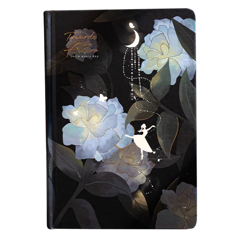 A5 notebook with a luminous cover open to show pages with colour illustrations.