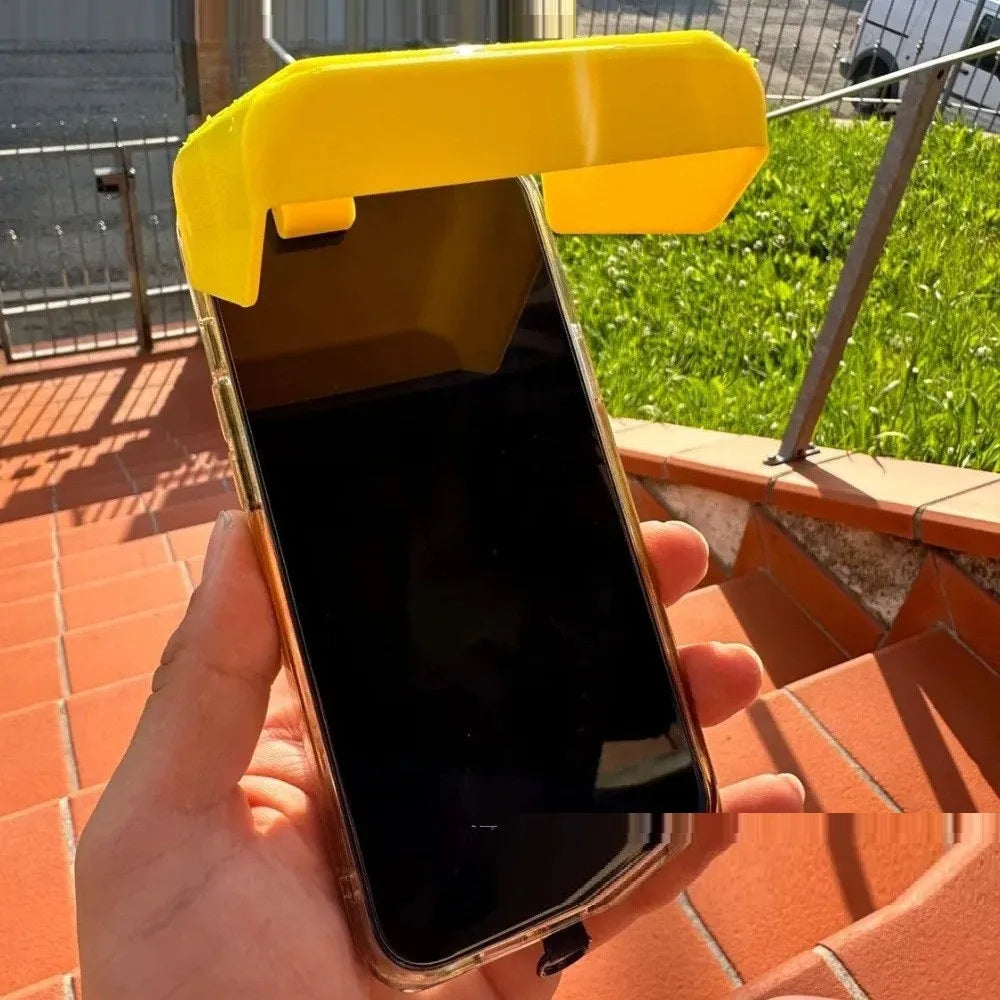 Yellow foldable plastic phone sunshade holder with phone clip for beach use.