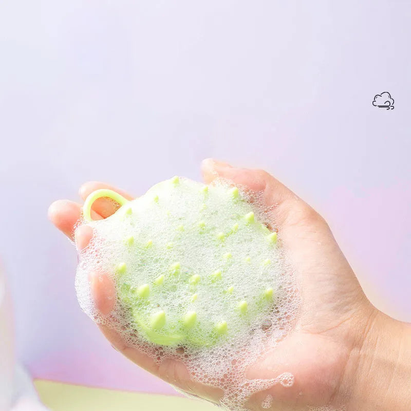 Silicone pet grooming brush in multiple colours for dogs and cats, showing flexible bristles.