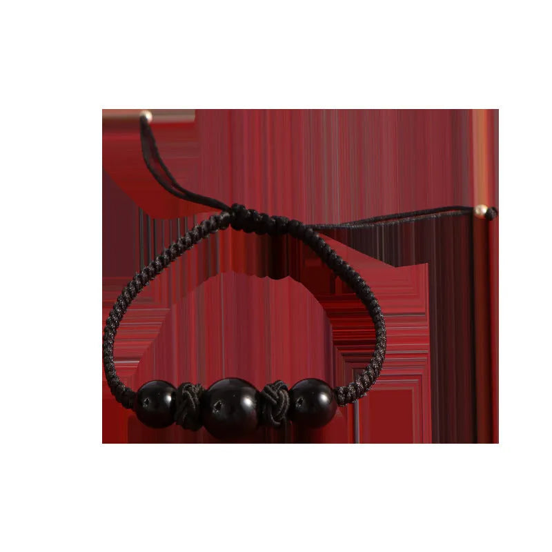 Woven red rope bracelet with strawberry quartz beads and alloy clasp