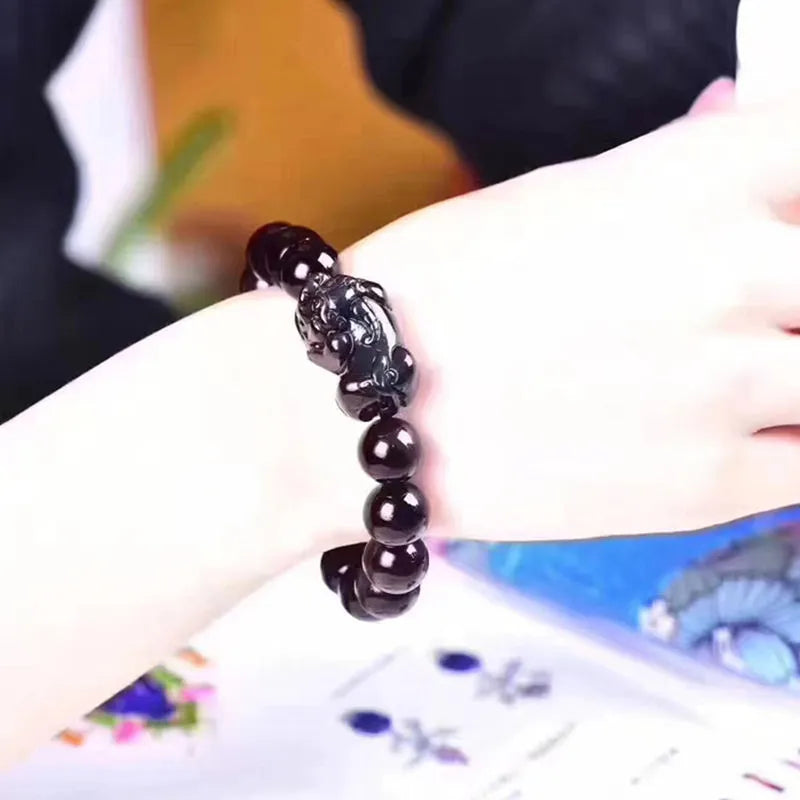 Natural ice colour eye obsidian crystal bracelet with polished round beads on wrist