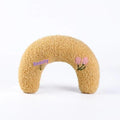 Blue and yellow cat sleeping mats with U-shaped neck pillows in moon and question mark shapes on a white background.