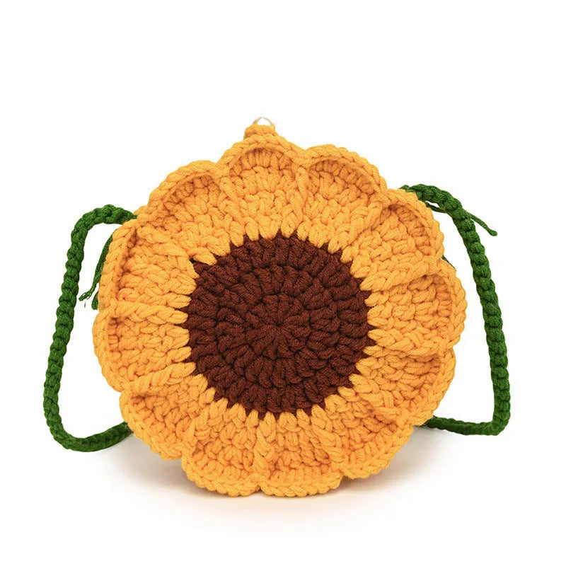 Hand-woven wool bag with crocheted flowers and round suitcase shape