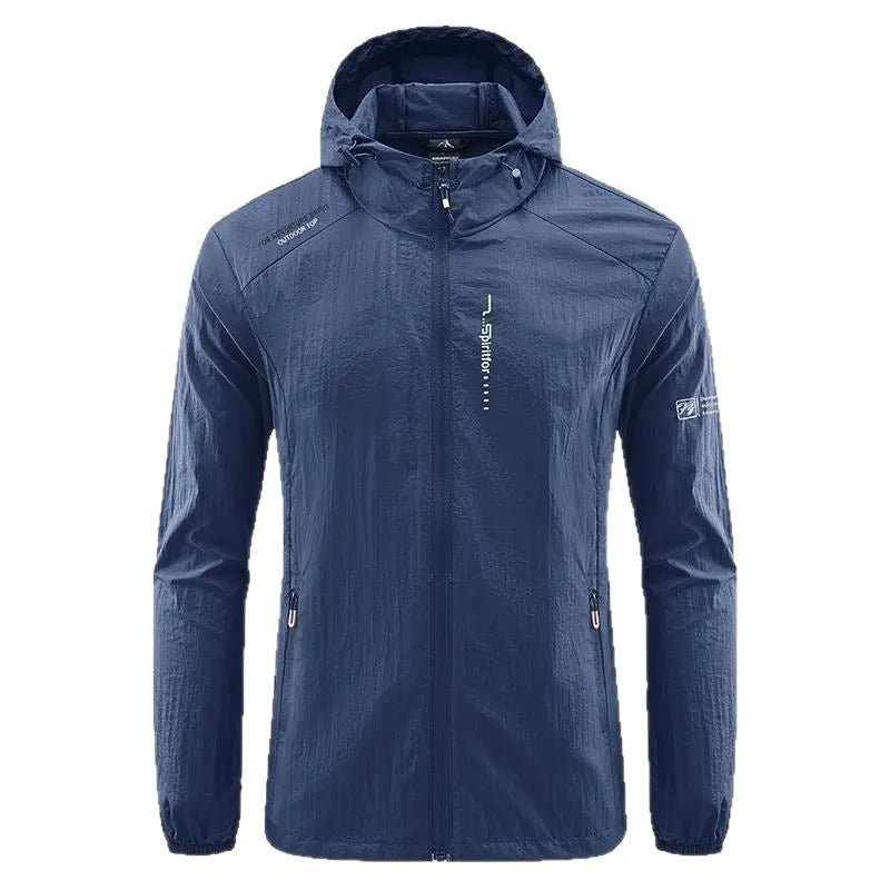 Man wearing a lightweight grey hooded nylon jacket suitable for summer outdoor activities.