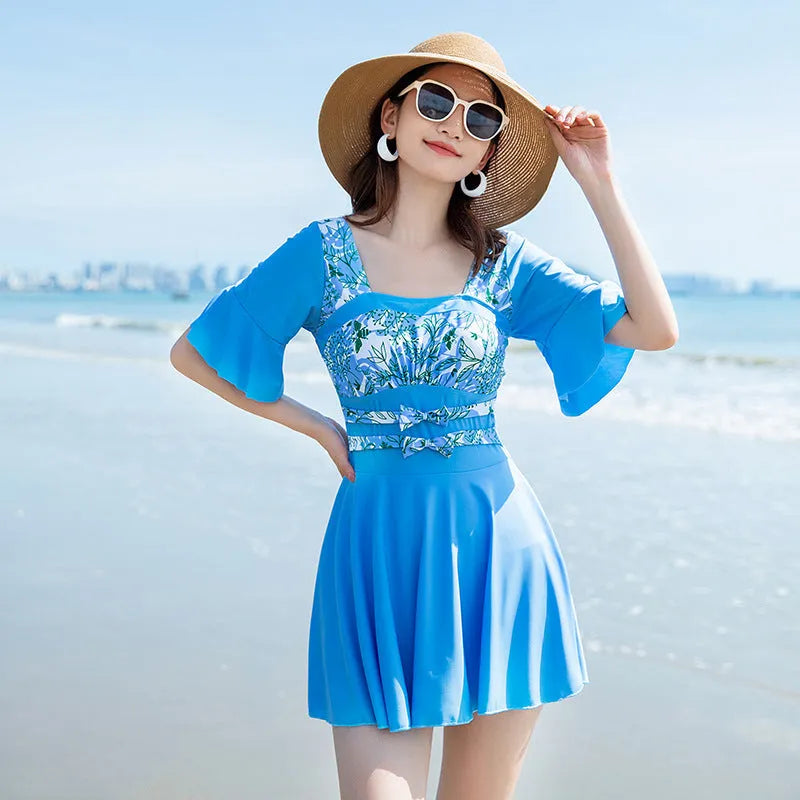 Women's blue and green seaside floral print one-piece swimsuit on size chart