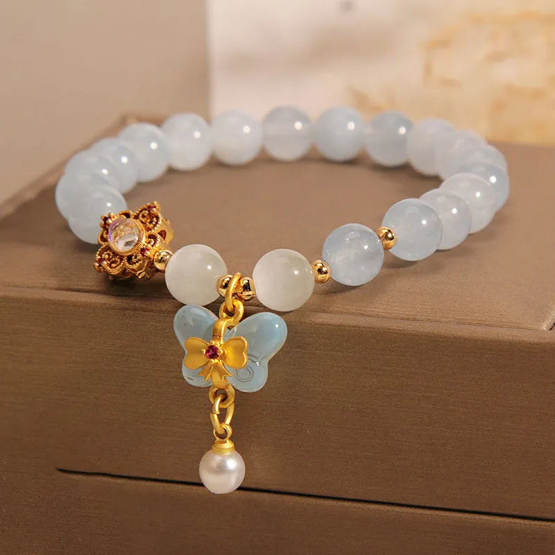 Crystal bracelet with aquamarine butterfly pendant and rhinestone details for women
