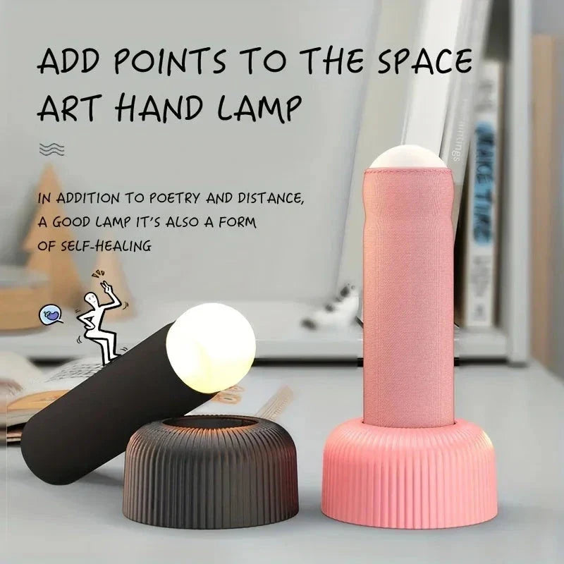 Innovative handheld LED night light with soft, fabric-like texture and soothing warm glow for a cozy, tranquil atmosphere