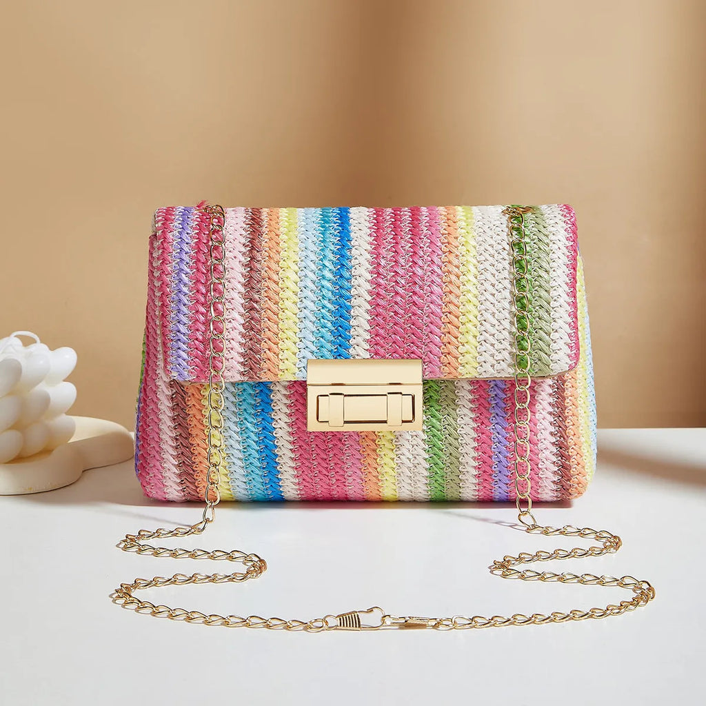 Women's soft straw cross-body bag in square shape with phone pocket, shown in blue colour