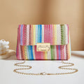 Women's soft straw cross-body bag in square shape with phone pocket, shown in blue colour