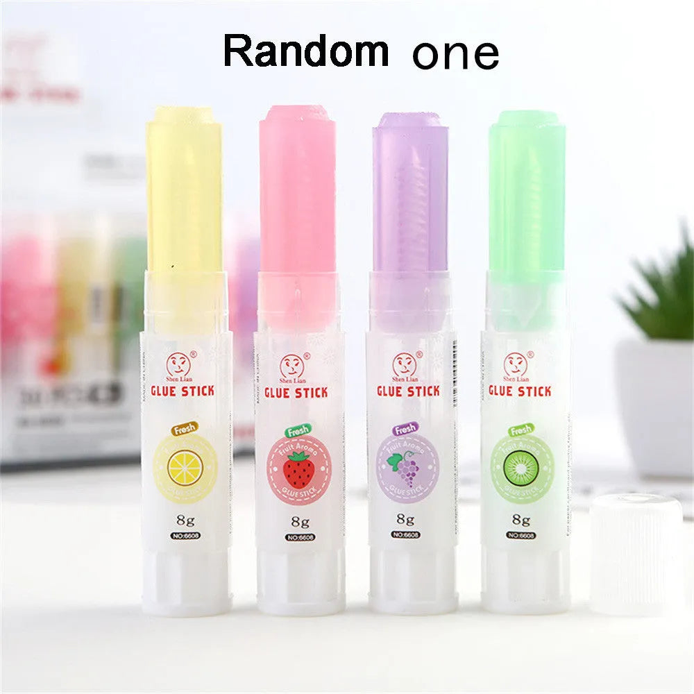 Jelly fruit fragrance solid glue stick in random colour, 8.5cm long, for students and crafts.