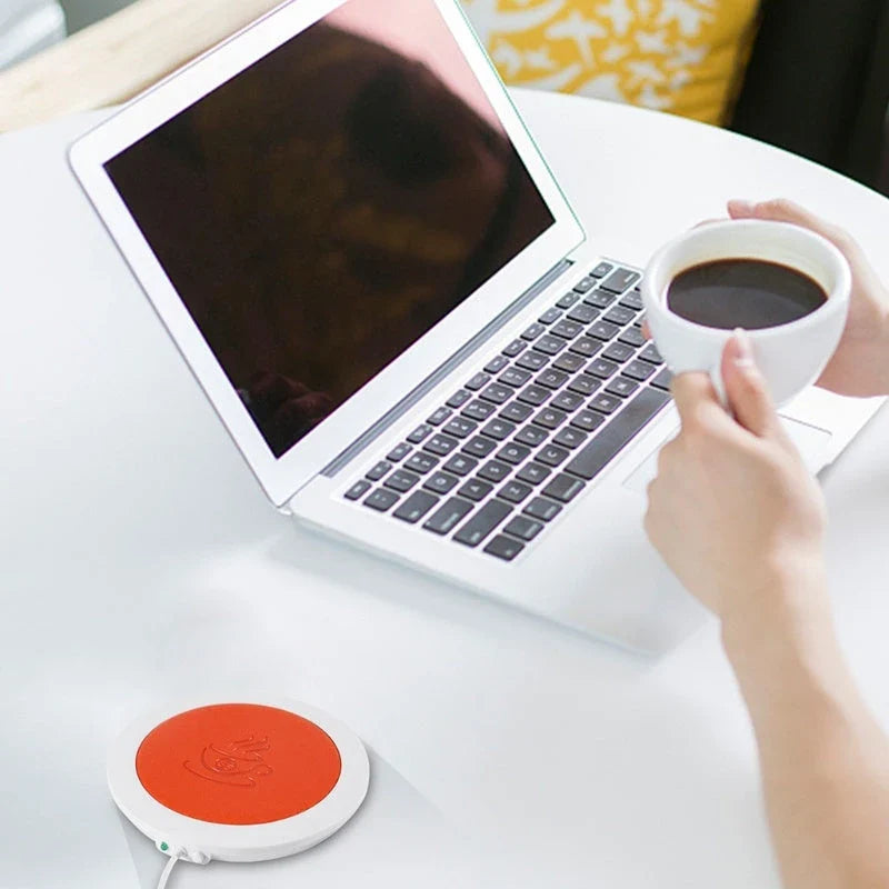 Stylish USB-powered mug warmer with a sleek, modern design that keeps your coffee, tea, or hot chocolate at the perfect temperature all day.