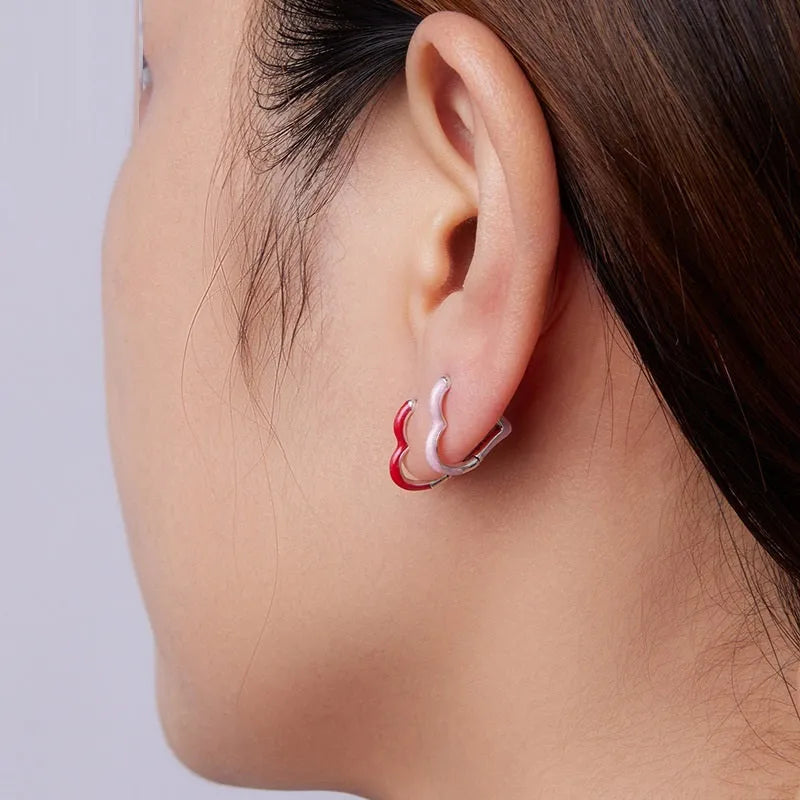 Pair of 925 silver heart stud earrings with pink or red dripping oil finish