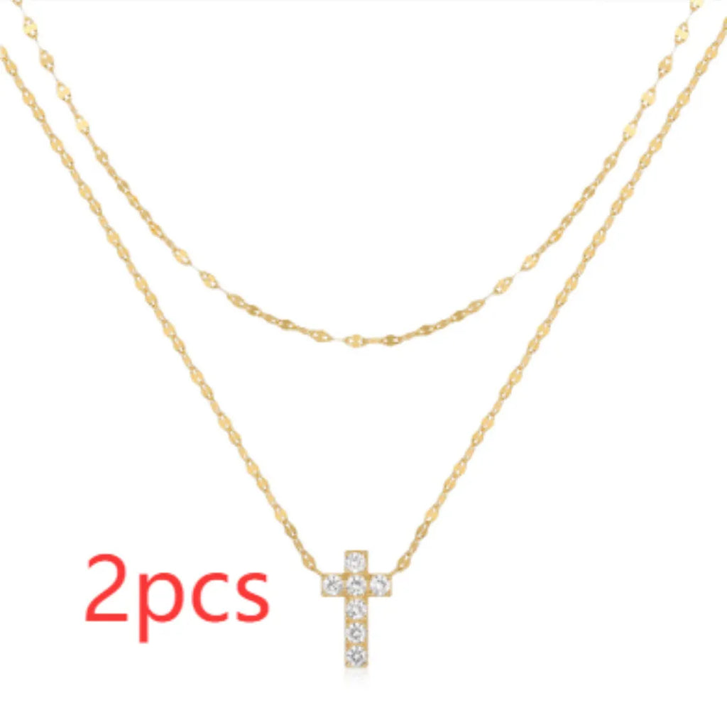 S925 sterling silver double layer twin diamond cross pendant necklace on a clavicle chain.