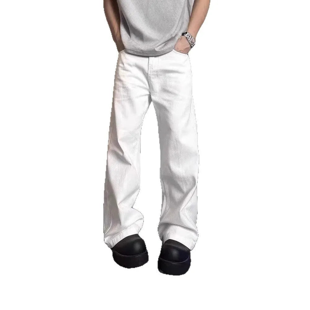 Men's white straight-leg cotton jeans with a wide-leg opening and zipper fly.