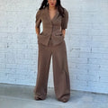 Brown men's two-piece suit with slim-fit waist design showing top and trousers
