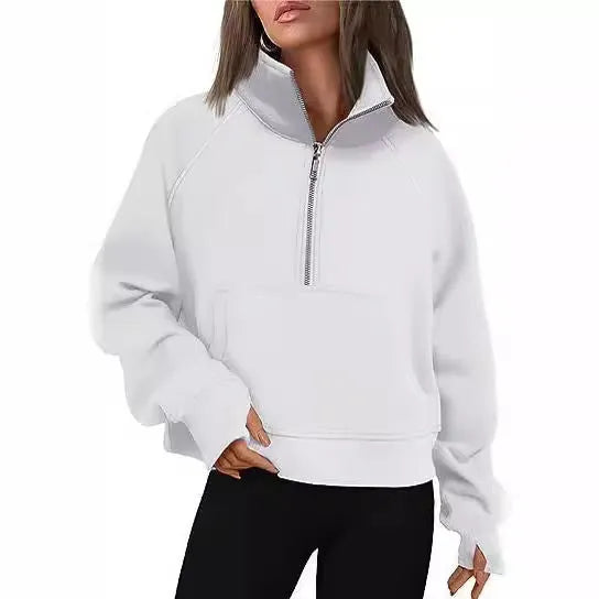Woman wearing a loose lapel fleece-lined sweater in a solid colour, showing raglan sleeve detail.