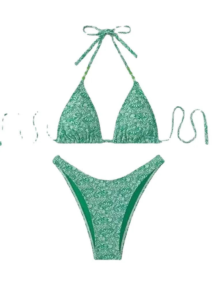 Women's floral pattern halter lanyard bikini set in emerald green, shown with top and shorts.