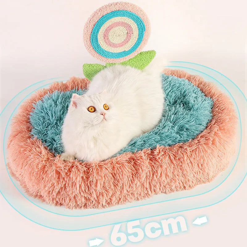 Pink elliptical plush cat bed with removable cover for small to medium cats