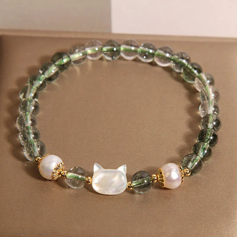 Green phantom quartz women's bracelet with a delicate shell kitten charm.