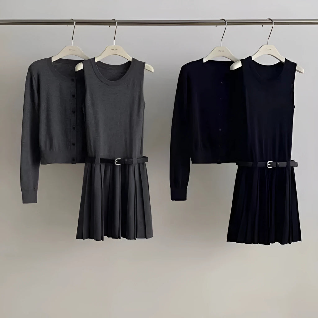 Women's black knitted vest skirt and long-sleeved cardigan two-piece set with pleats and a belt.