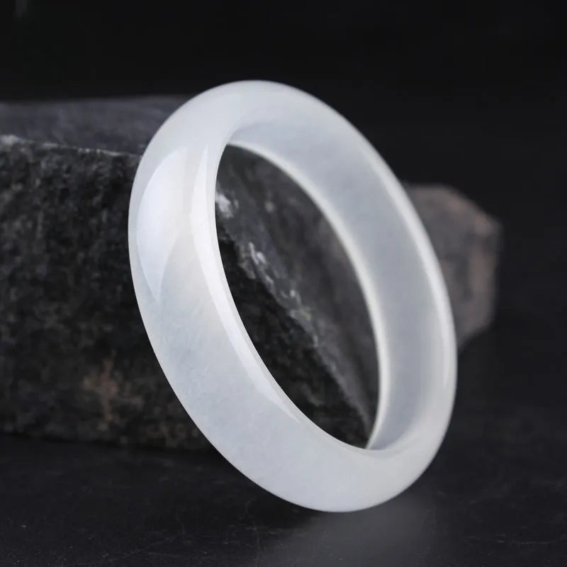 Gao Bing jade bracelet in ice-like white moonlight colour on a wrist, showing flat rod and round rod style options.