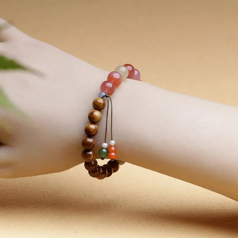 Handmade agate bracelet with 8mm diamond-shaped beads showing natural persimmon colour elements