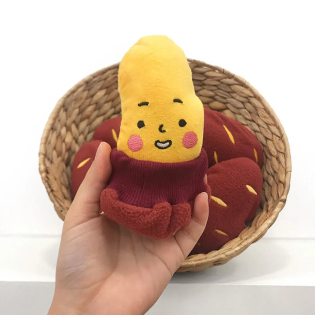 Red sweet potato shaped dog puzzle toy with hidden treat compartment