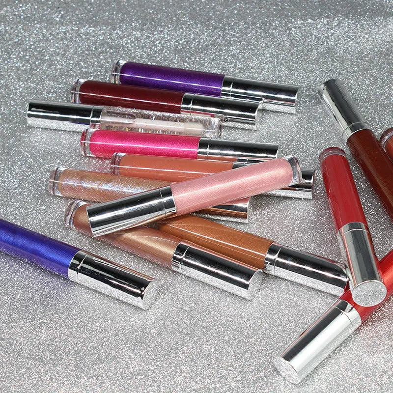 Pearl lip gloss clear lip oil in a logo-free round tube with mirror, pearl light, and water light finish