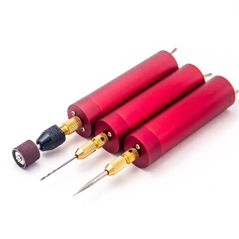 Micro USB electric grinder with three drill bits and wrench on a white background