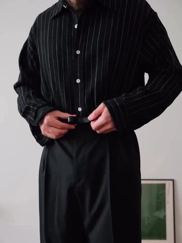 Men's black pinstriped button-down polyester shirt with long sleeves and a regular fit.