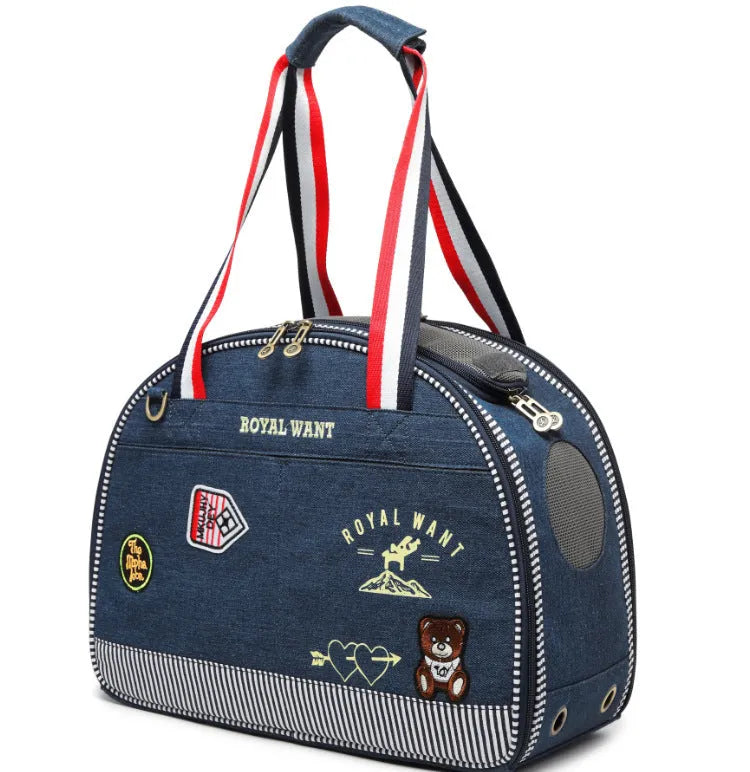 Blue denim pet diaper bag with cartoon patterns measuring 43cm by 20cm by 30cm
