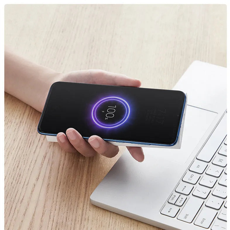 White 10000mAh power bank showing USB-C port and wireless charging symbol