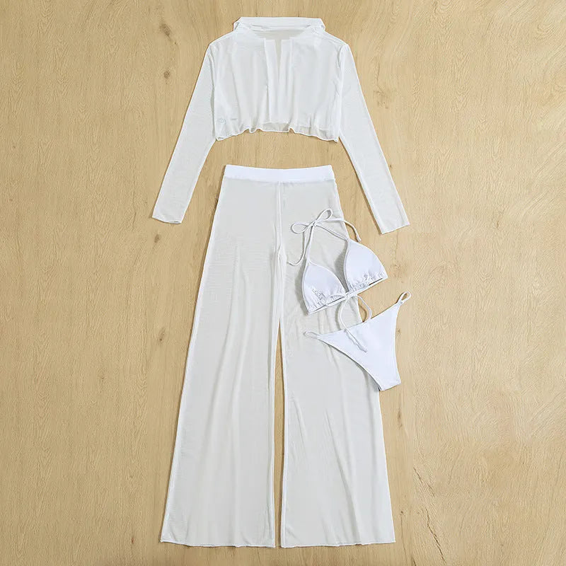White women's swimsuit four-piece set showing backless top and high-waisted trousers