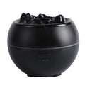 White round desk aromatherapy humidifier and essential oil diffuser with water tank on a wooden table.