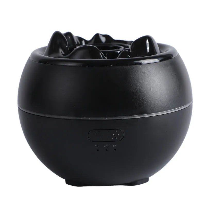 White round desk aromatherapy humidifier and essential oil diffuser with water tank on a wooden table.