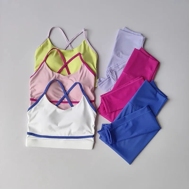 Women's blue and white quick-dry nylon spandex yoga pants and sleeveless tank top set for fitness.