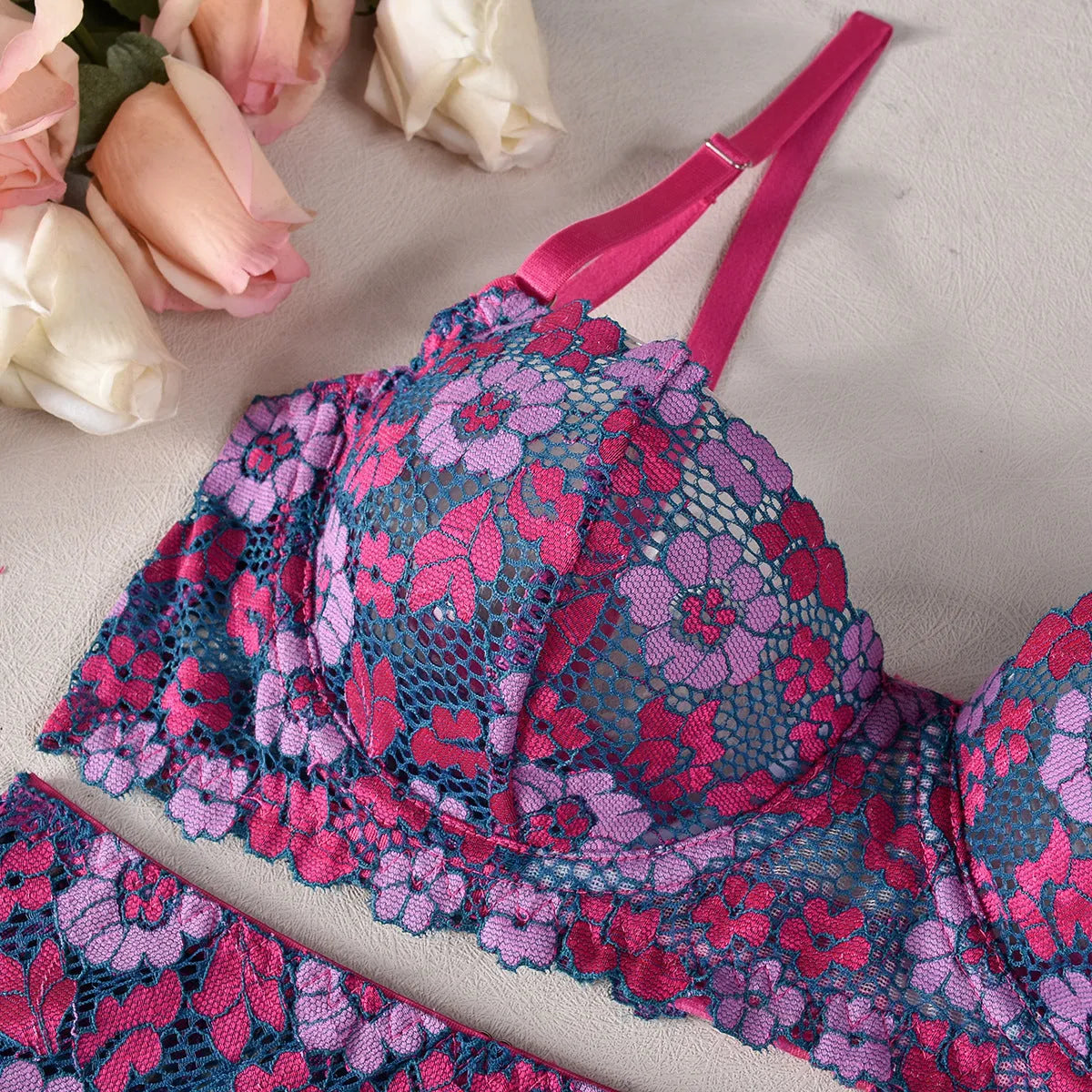Rose red women's two-piece bikini set with contrast colour panels and fashion embroidery detail.